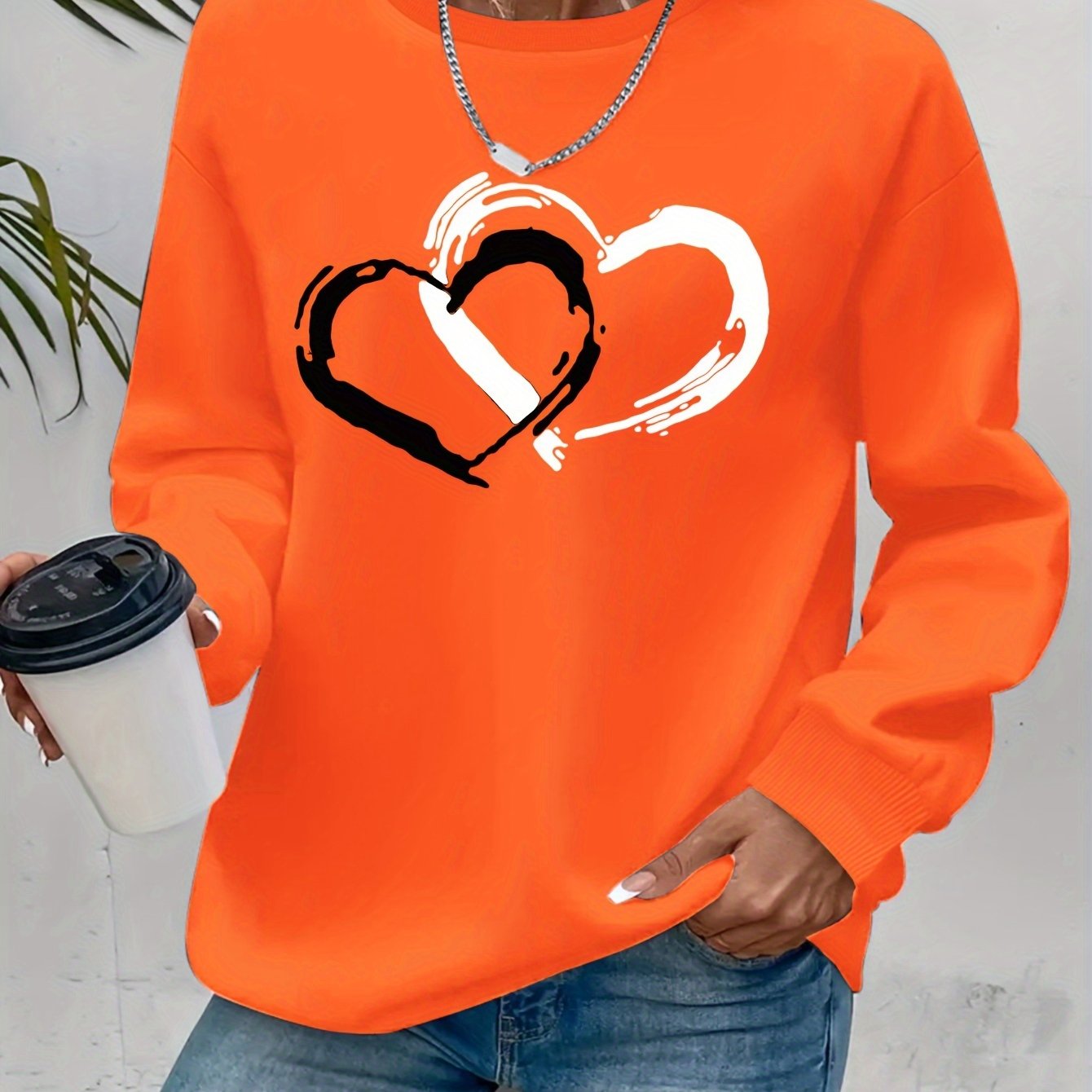 Sweatshirt mit Herz-Print – Verspielter Komfort mit Liebevollem Flair