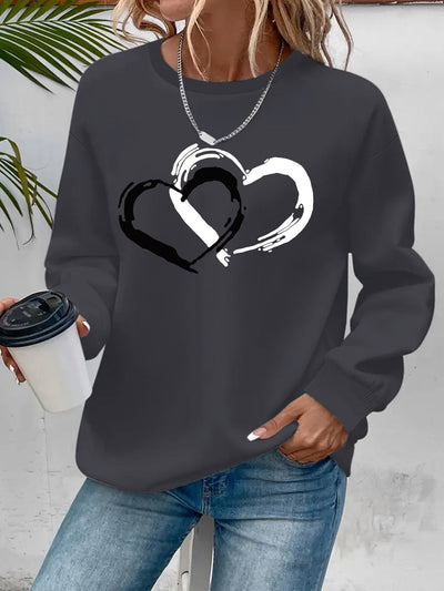 Sweatshirt mit Herz-Print – Verspielter Komfort mit Liebevollem Flair