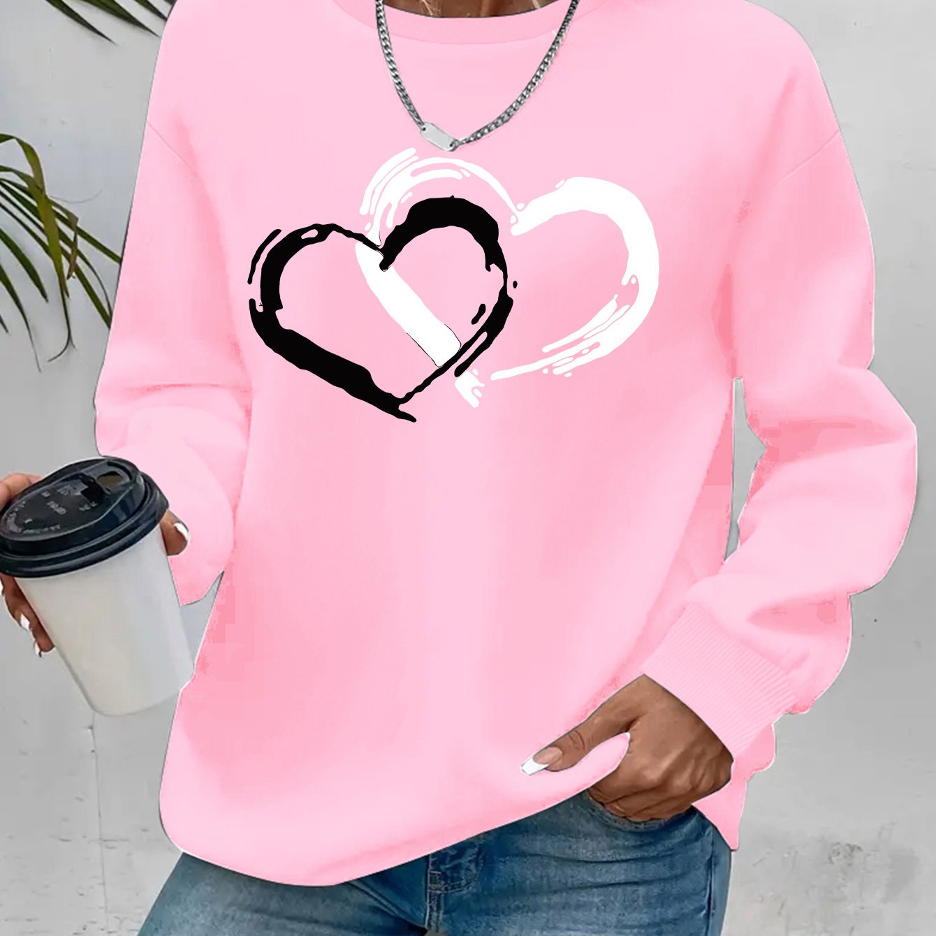 Sweatshirt mit Herz-Print – Verspielter Komfort mit Liebevollem Flair