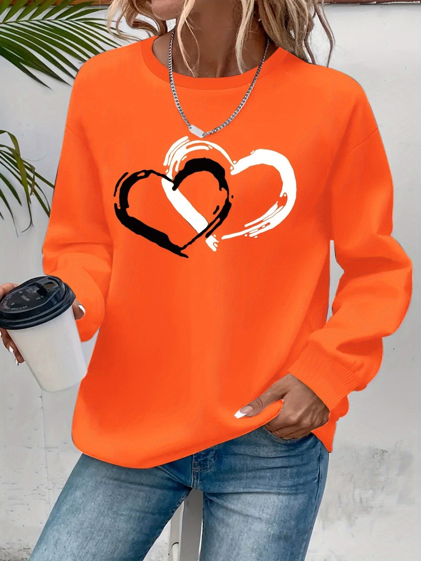 Sweatshirt mit Herz-Print – Verspielter Komfort mit Liebevollem Flair
