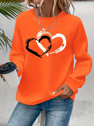 Sweatshirt mit Herz-Print – Verspielter Komfort mit Liebevollem Flair