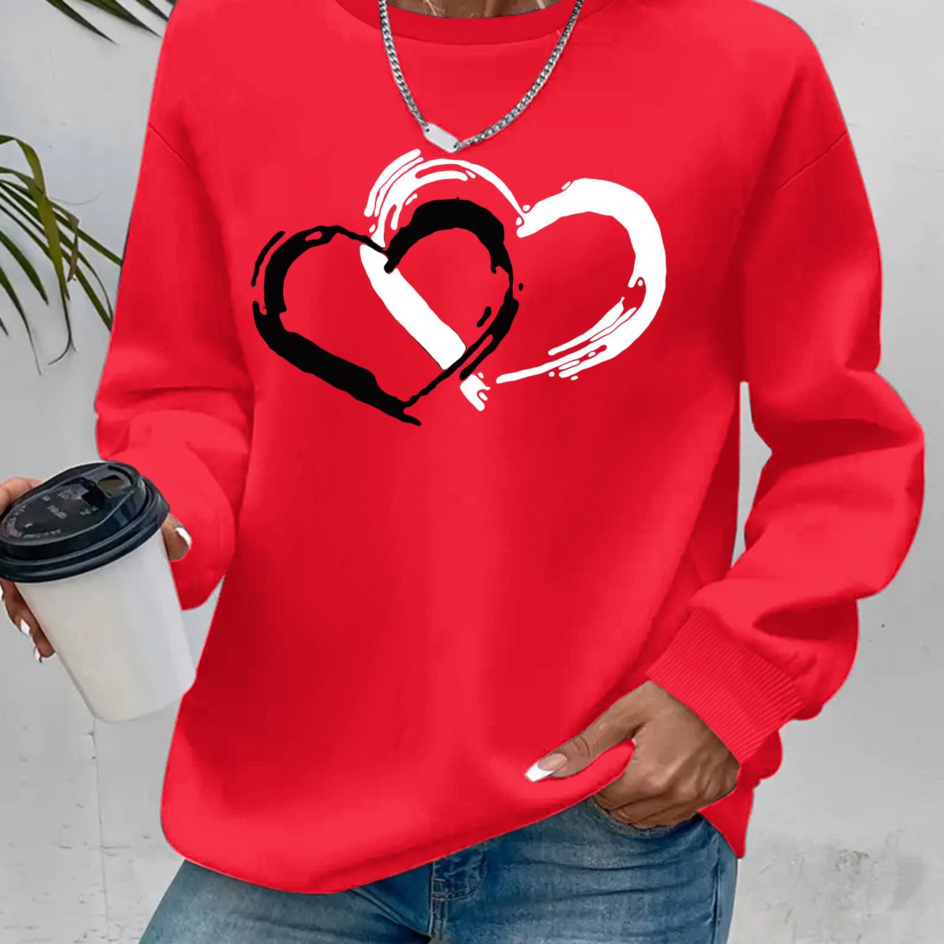 Sweatshirt mit Herz-Print – Verspielter Komfort mit Liebevollem Flair